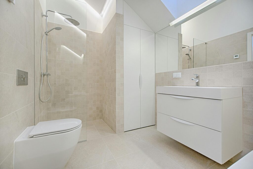Gloucestershire bathroom renovation with modern walk-in shower and fitted plumbing by local plumber.
